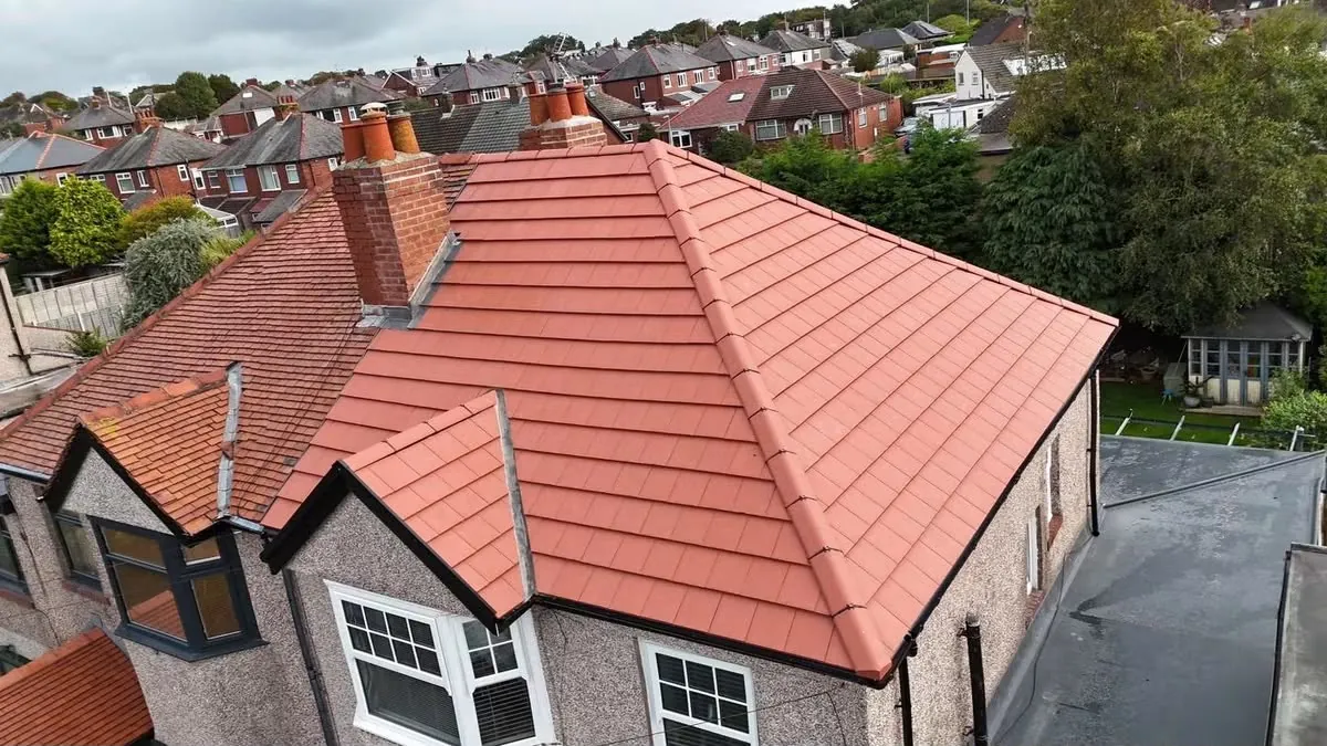 Red concrete tiled hipped roof on a bungalow