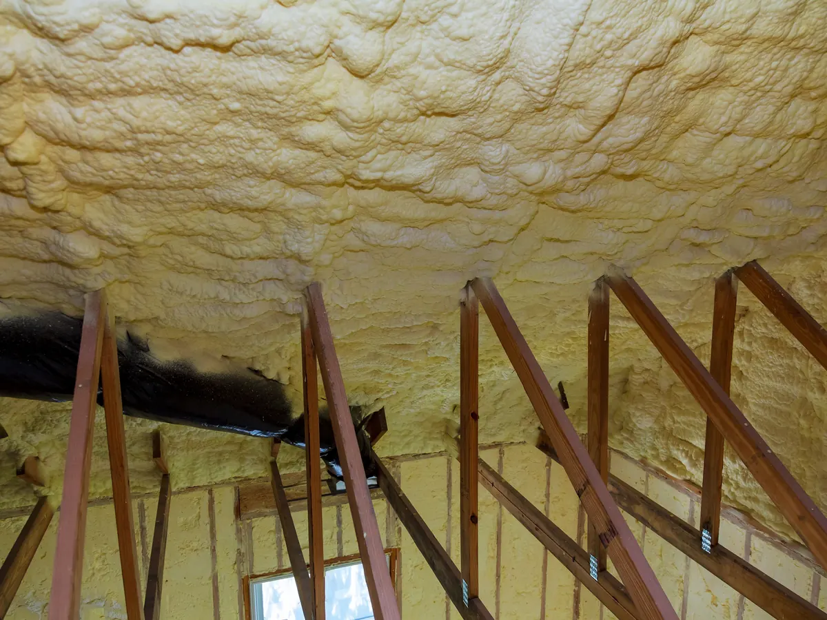 Close view of spray foam removal work in progress