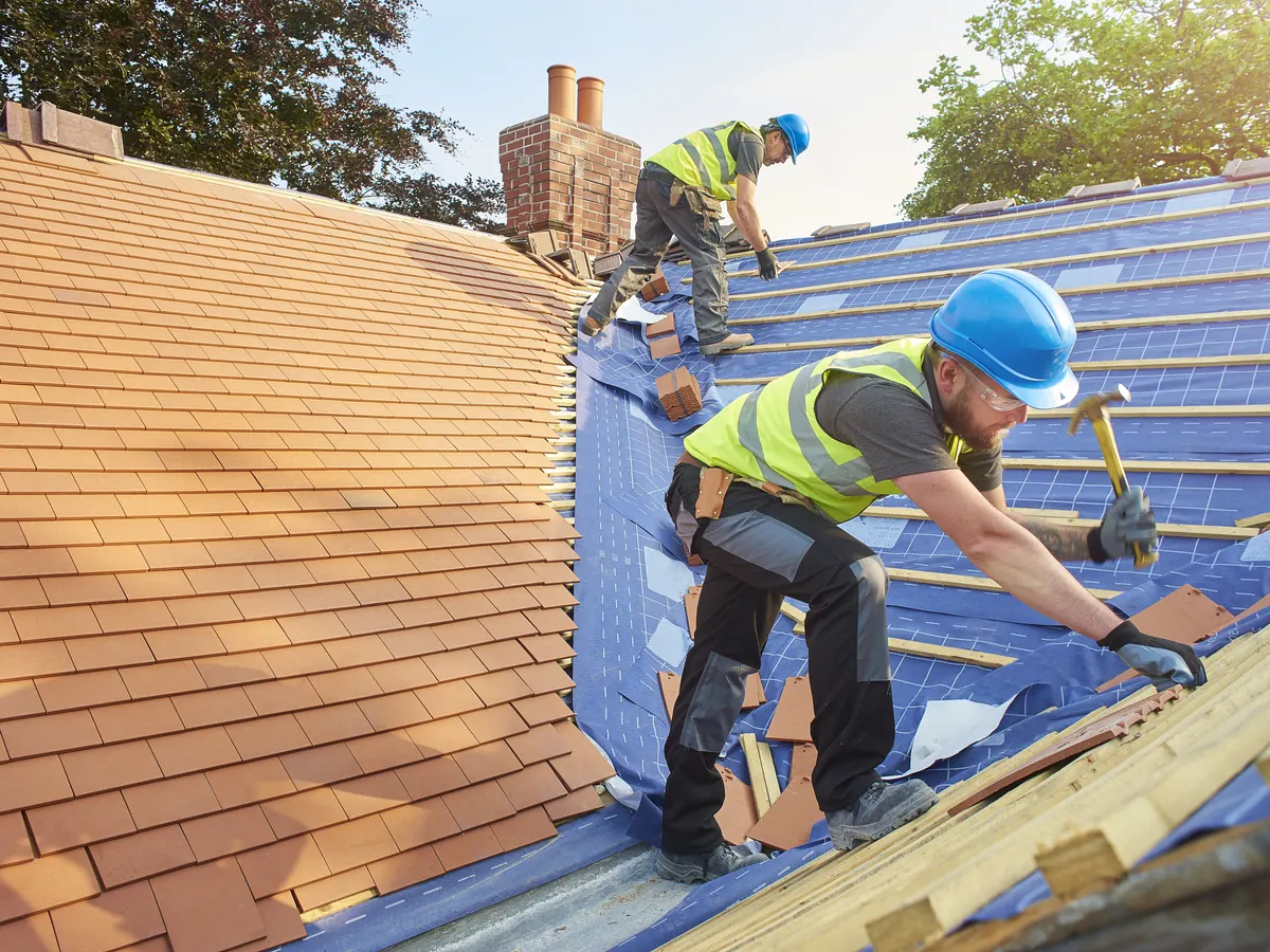 Close view of tile roofs work in progress
